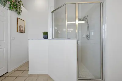 a shower with a glass door in a bathroom at 108 Stetson Court Kissimie in Kissimmee