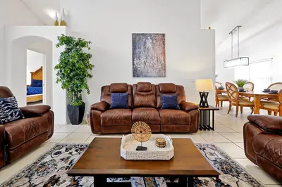 a living room with a couch and a table at 108 Stetson Court Kissimie in Kissimmee