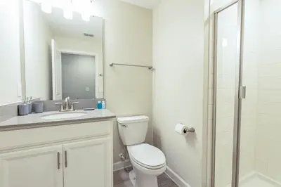 a bathroom with a toilet and a sink and a shower at TVPM-5005WASL in Kissimmee