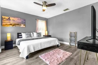 a bedroom with a bed and a ceiling fan at TVPM-1191MBBV in Kissimmee