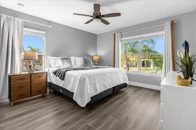 a bedroom with a bed and a ceiling fan at TVPM-1191MBBV in Kissimmee