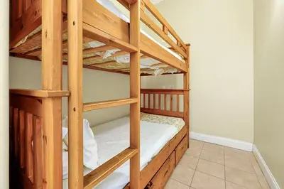 a couple of bunk beds in a room at 13415 BLUE HERRON BEACH DR in Orlando