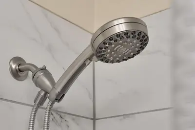 a shower with a shower head in a bathroom at 5017 WINDERMERE 4BED in Kissimmee