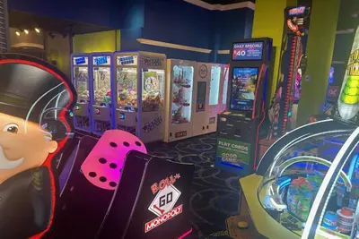 a room with a video game machine and a game console at Wyndham Garden Lake Buena Vista – Disney Springs® Area in Orlando