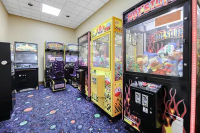 a row of arcade games in a room at Prime Location 1BR Apt Near Epic OCCC in Orlando