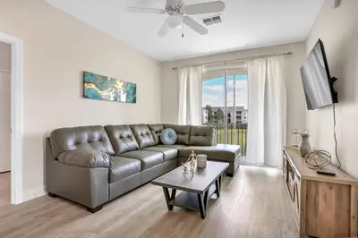 a living room with a couch and a table at Big Condo 3 bedrooms, Pool in Kissimmee