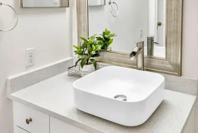 a bathroom with a white sink and a mirror at Big Condo 3 bedrooms, Pool in Kissimmee