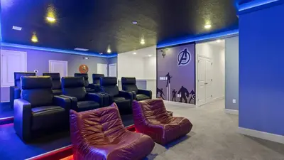 a room with a waiting room with leather chairs at Lakeside Villa with Pool BBQ Cinema & Games Room in Kissimmee