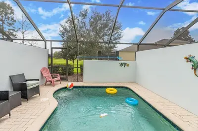 a swimming pool with frisbees in a house at 2554 RENSHAW ST KISSIMMEE 3BEDS in Orlando