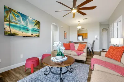 a living room with a couch and a table at 8105 COCONUT PALM WAY UNIT 205 KISSIMMEE 3BEDS in Kissimmee