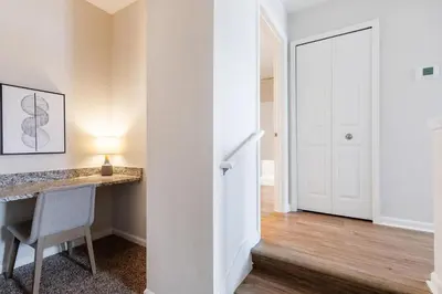 a room with a desk and a chair and a door at Landing Beautiful 1BD Gym Pool in Orlando