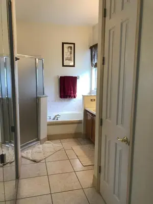 a bathroom with a shower and a bath tub at Formosa Villa with Private Pool & 5 Miles to Disney in Orlando