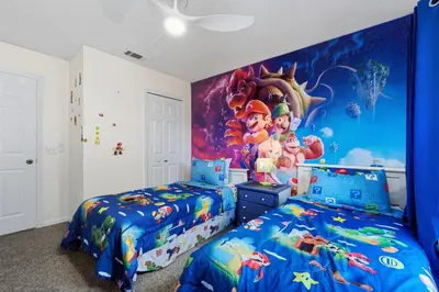 a bedroom with two beds and a disney mural at Private Hot Tub Terra Verde Resort Pool Themed Rooms in Kissimmee