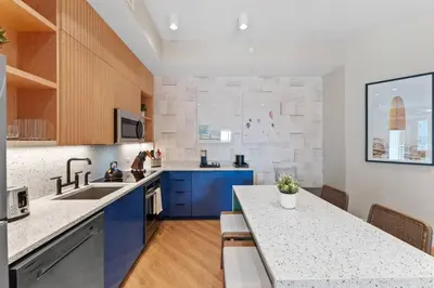 a kitchen with blue cabinets and a counter top at 8070-304 Luxury 2BR Apt Kissimmee Orlando Disney in Orlando