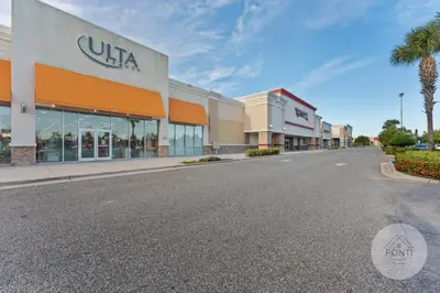 an empty street in front of a shopping center at 8070-304 Luxury 2BR Apt Kissimmee Orlando Disney in Orlando