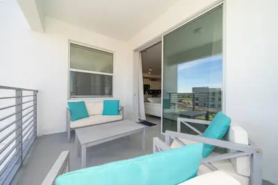 a balcony with two chairs and a table at Resort Condo 10 Min to Disney in Kissimmee