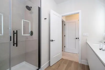 a bathroom with a shower and a sink at Stylish Property with Private Pool in Orlando