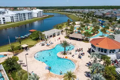 an aerial view of a pool at a resort at Modern Condo Near Disney in Kissimmee