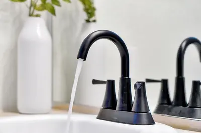 a sink with a faucet with water coming out of it at Windsor Hills Family Paradise in Orlando
