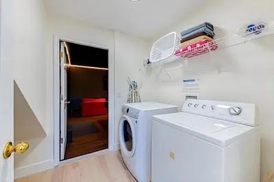a laundry room with a washer and dryer at EIR2706 - 7B Lakefront Resort 8 min to Disney in Kissimmee