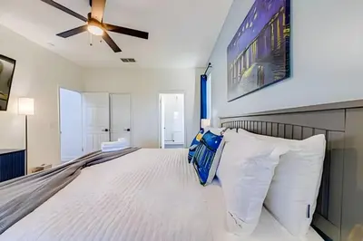 a bedroom with a bed and a ceiling fan at EIR2706 - 7B Lakefront Resort 8 min to Disney in Kissimmee