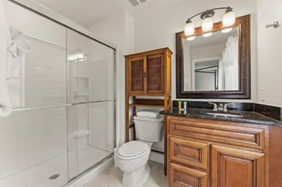 a bathroom with a toilet and a sink and a shower at Palm Tree in Paradise - 10ppl in Kissimmee