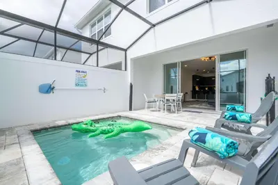 a pool with a turtle in the middle of a house at Modern 3Bd Screened Pool at Serenity Resort 17322 in Orlando
