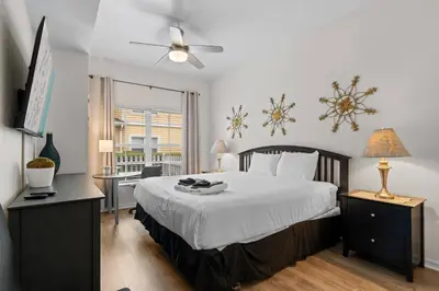 a bedroom with a large bed and a window at 3 Bedroom 2 Bathroom Villas At Seven Dwarfs 25-105 in Kissimmee