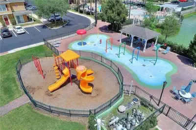 an aerial view of a park with a playground at 3 Bedroom 2 Bathroom Villas At Seven Dwarfs 25-105 in Kissimmee