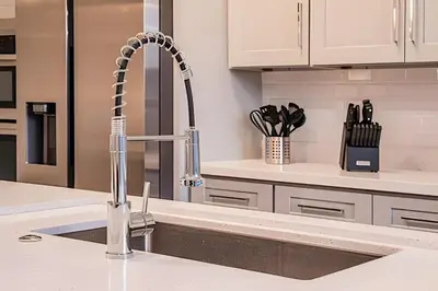 a kitchen with a sink and a faucet at Windsor Hills 4Q c Piscina + Game Room Mario in Orlando