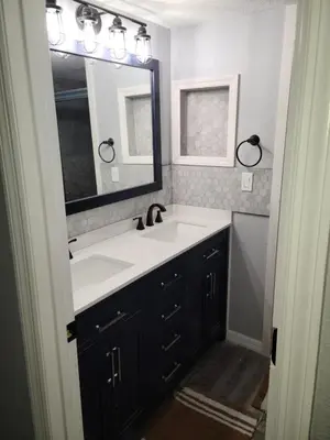 a bathroom with a sink and a mirror at Great condo getaway! in Kissimmee