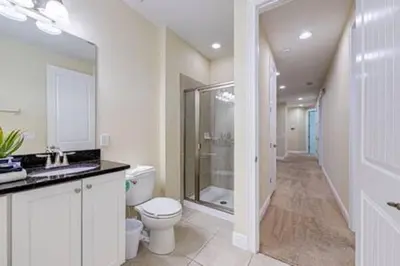 a bathroom with a toilet and a sink and a shower at ECR641 8B Stunning Dream Vacation @Encore in Orlando