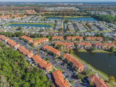 an aerial view of a housing estate with a lake at Private Hot Tub near Disney Parks in Kissimmee