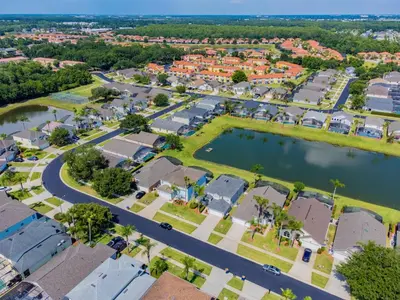 an aerial view of a town with houses and a lake at Private Heated Pool near Disney in Kissimmee