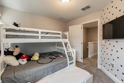 a bedroom with two bunk beds with stuffed animals at Themed Bedrooms BBQ Near Disney in Kissimmee