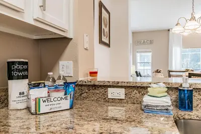 a kitchen with a counter top with a sink at Family Home Near Disney – Modern Bright in Kissimmee