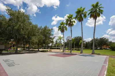 a basketball court in a park with palm trees at Family Villa w Pool · 20min Disney in Kissimmee