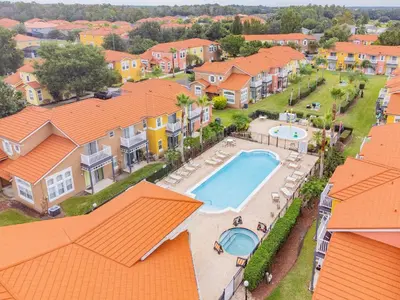 an aerial view of a house with a swimming pool at Cozy 3BR Townhome Near Disney in Kissimmee in Kissimmee