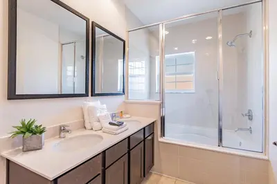 a bathroom with a sink and a shower at 2BR Villa Near Disney Resort Amenities in Kissimmee
