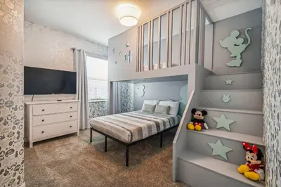 a childs bedroom with a bunk bed with stars on the wall at Luxury Resort · Pool Lazy River in Kissimmee
