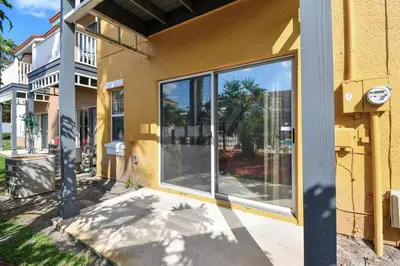 a building with large glass windows on the side of it at Family Stay Close to Disney Parks in Kissimmee