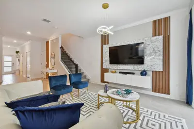 a living room with a couch and a tv at Family Retreat near Disney in Kissimmee