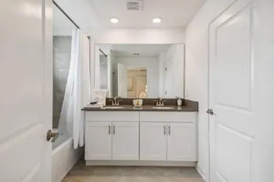 a bathroom with a sink and a mirror at Family Retreat near Disney in Kissimmee