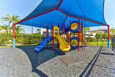 a playground with a blue tent and a slide at Orlando Stay Near Universal Studios in Orlando
