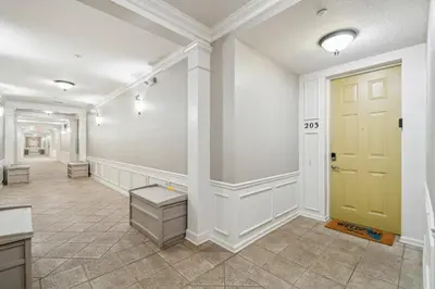 a hallway with a yellow door in a building at Orlando Stay Near Universal Studios in Orlando