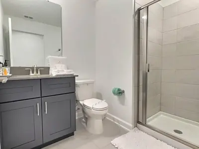 a bathroom with a sink toilet and a shower at Orlando Luxury Stay Near Disney Parks in Kissimmee