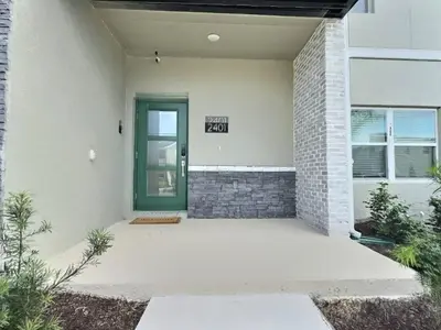 a front door of a house with a sign on it at Orlando Luxury Stay Near Disney Parks in Kissimmee