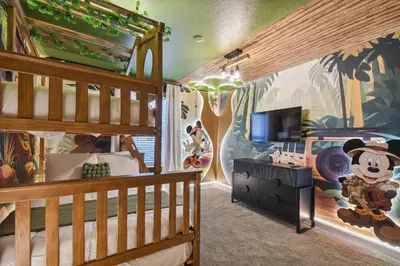 a childs room with a mickey mouse mural at Orlando Getaway – Minutes to Disney Parks in Kissimmee