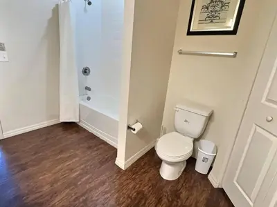 a bathroom with a toilet and a shower at Family Getaway Near Disney Parks in Kissimmee