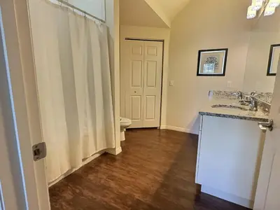 a bathroom with a toilet and a sink and a shower at Family Getaway Near Disney Parks in Kissimmee